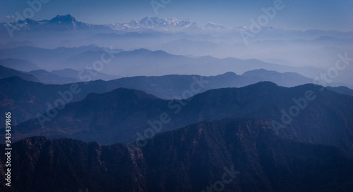 Aerial view of  layers of hills and mountains in western Nepal, on the flight to Rara Lake in Mugu from Nepalgunj. Layers of mountain range in the Himalayas.