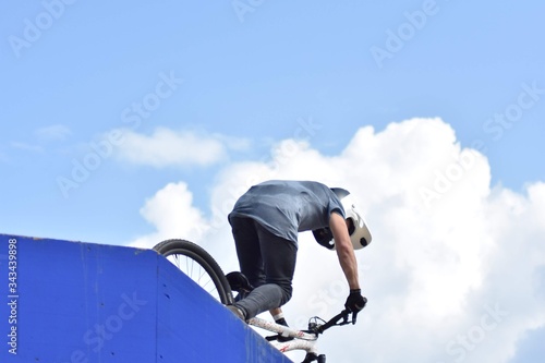 guy on bmx performing tricks in the air  © Diego