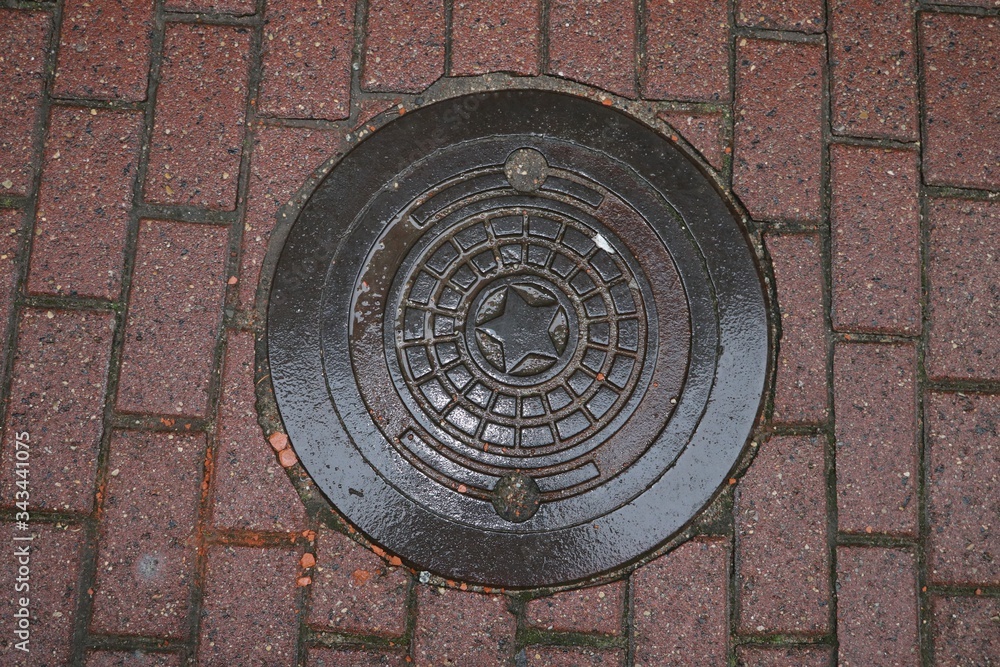 Sewerage hatch on the brickroad