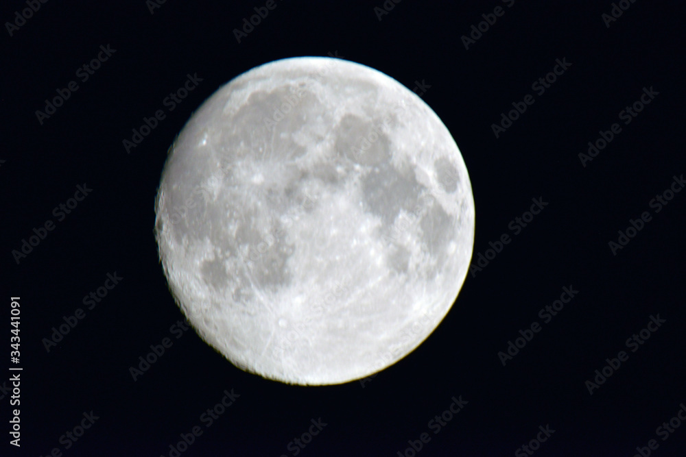 Shooting the moon on a summer evening in the Vosges region of France Shooting the moon on a summer evening in the Vosges region of France