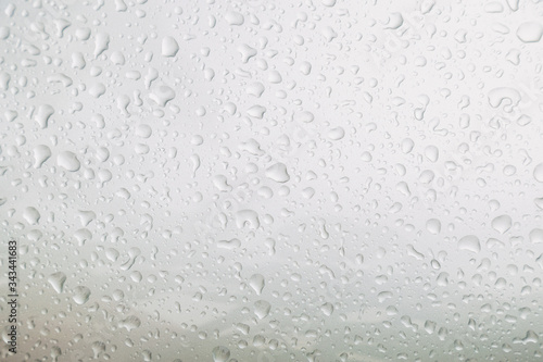 Top view rain drop on bronze car bonnet after rain fall for texture background.