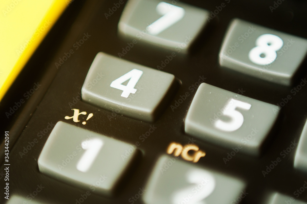 A close up portrait of the record button of a television or other multimedia device to start recording sound or a series or movie. it is surrounded by the buttons needed to play it again.