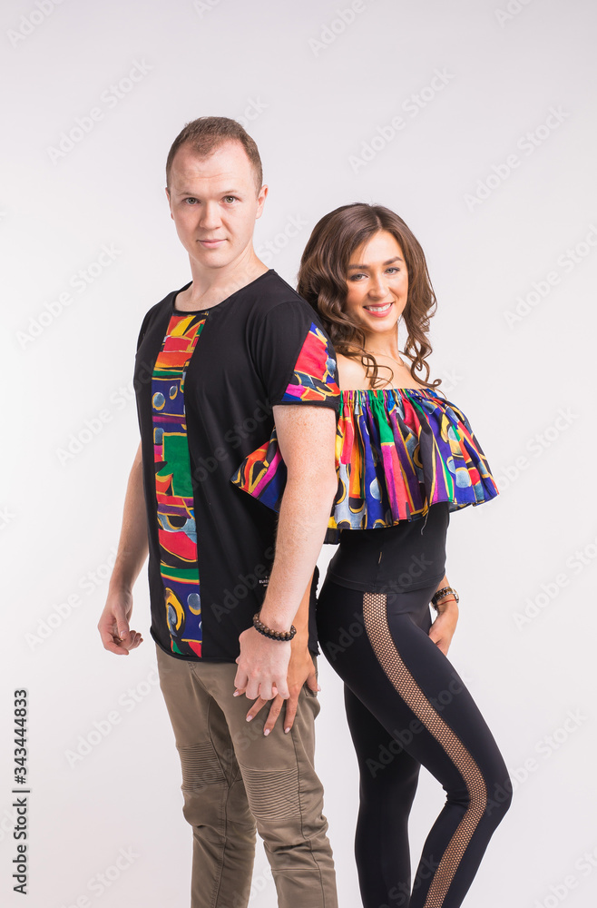 Funny couple dancing social dance. Kizomba or bachata or semba or taraxia , on white background. Social dance concept. Funny couple dancing social dance. Kizomba or bachata or semba or taraxia , on white background. Social dance concept.