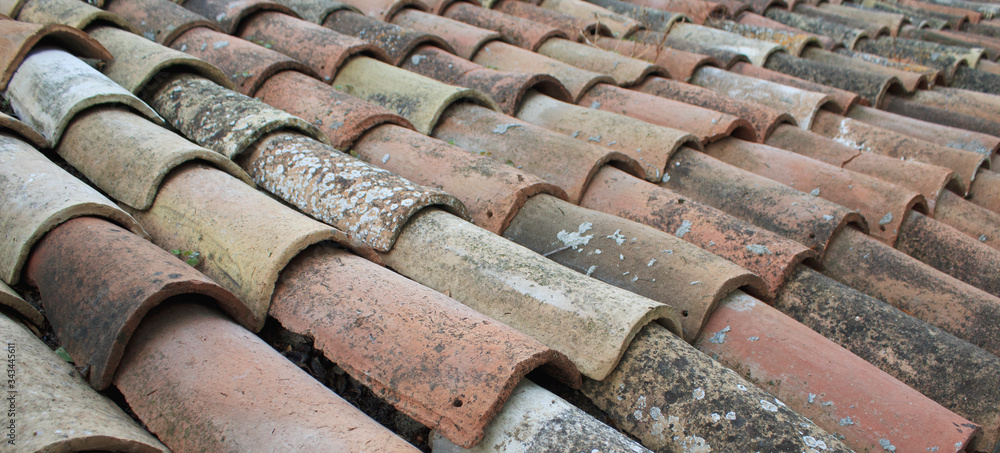 Tiles on old castle roof, architecture background. Brown roof tiles. Tiles on old castle roof, architecture background. Brown roof tiles.