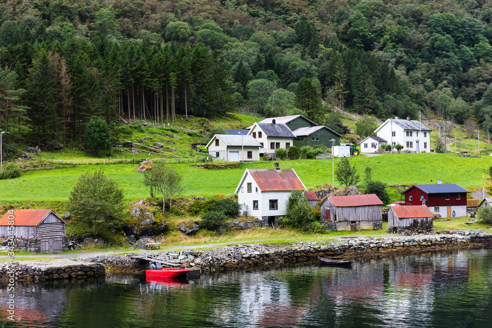 Fototapeta premium Reflection of houses in a norwegian fjord