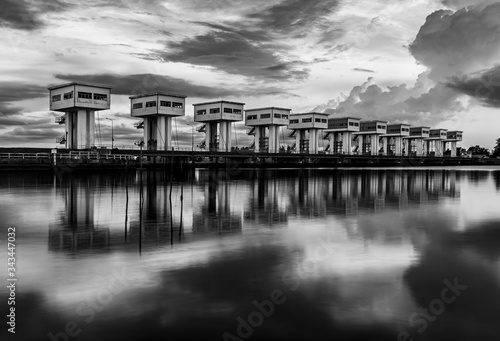 Water barrier with cloud sky and river in twilight, Black and white and monochrome style © jimbophotoart