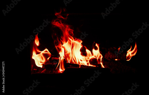 Burning and glowing pieces of wood in Fireplace