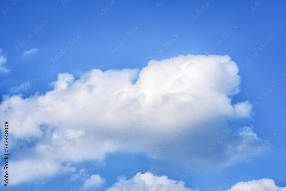 Fluffy white clouds on background of blue sky. Wallpaper. Fluffy white clouds on background of blue sky. Wallpaper.
