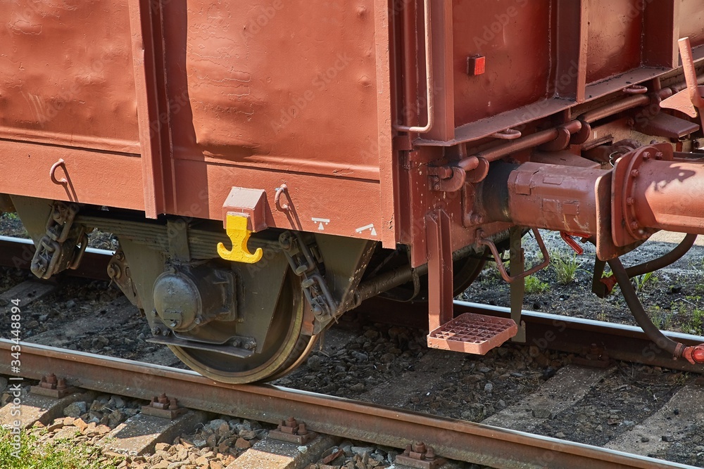 Freight train on the rails, closeup industrial detail