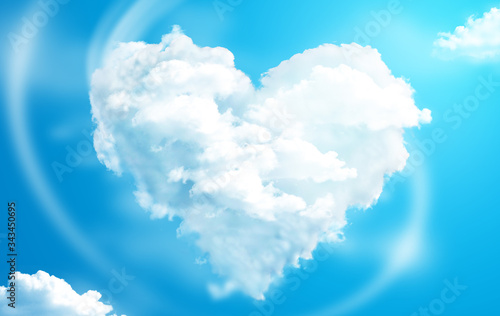 Heart shaped clouds in a blue sky photo