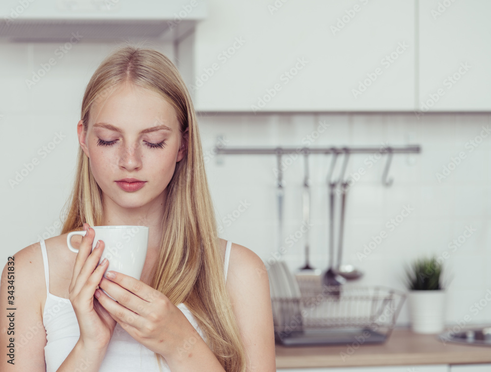 Woman kitchen with coffe cup in hands home portrait lifestyle Woman kitchen with coffe cup in hands home portrait lifestyle