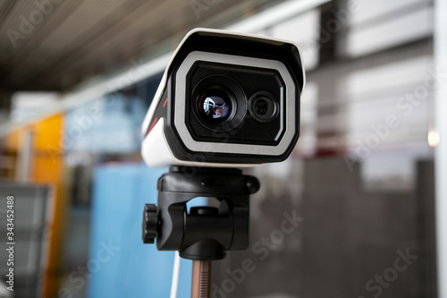 Thermal imaging camera at the airport. It is used to detect airport passengers temperature and determine high risk passenger of transmitting a disease