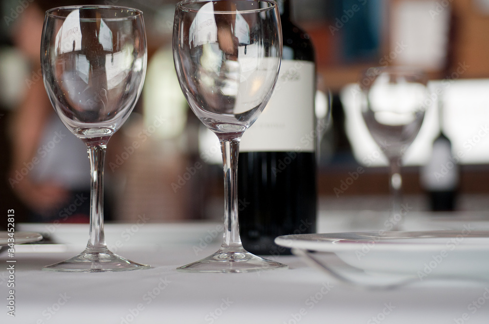 Restaurant table with crystal glasses and wine
Restaurant table with crystal glasses and wine