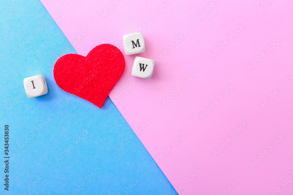 Fototapeta premium Inscription I LOVE M and W on color background