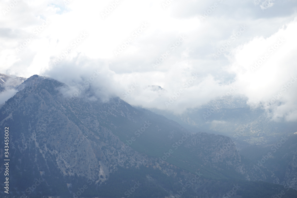  mountain view with snow and large clouds