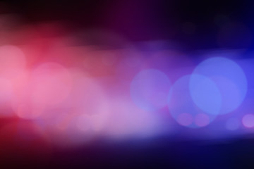 Blurred view of police cars on street at night