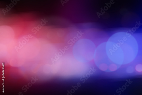 Blurred view of police cars on street at night