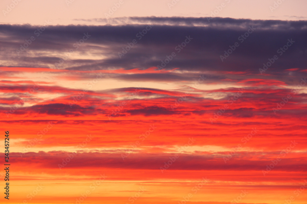 red-orange clouds in the sky after sunset