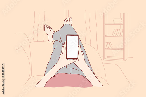 Techonology, mobile phone, network, communication concept. Human cartoon character lying on couch at home reading news or chatting in social media at watching at smartphone. Online interaction vector.