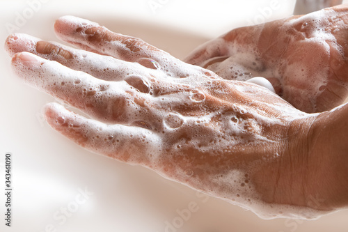 Thoroughly washing hands with soap
