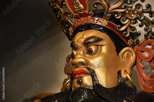 Face of God statue in entrance of the temple in side of the Po Lin Monastery. Lantau Island, Hong Kong photo