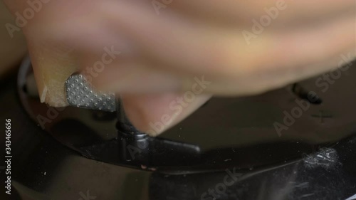 a man winds an old watch