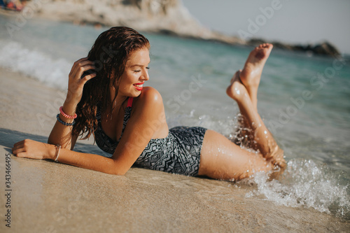 Young woman wearing bikini ...