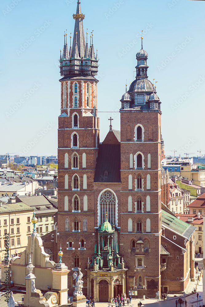 Beautiful view on Krakow famous landmark - St. Mary's Basilica (Mariacki Gothic Church)and Old Town of Krakow, made from the viewpoint on Town Hall. Travel concept