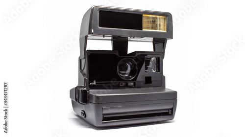 Black camera instant print photo on a white background when unfolded
