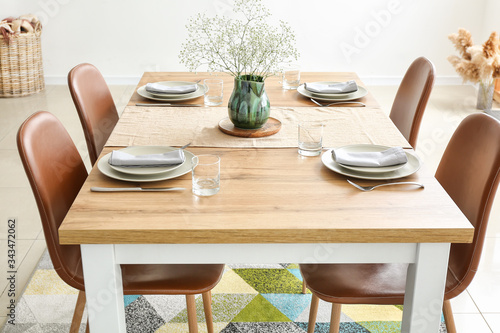 Served table in modern dining room photo