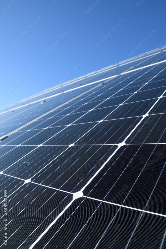 Solar panels against blue sky background.Against The Deep Blue Sky in suny weather Solar panels against blue sky background.Against The Deep Blue Sky in suny weather