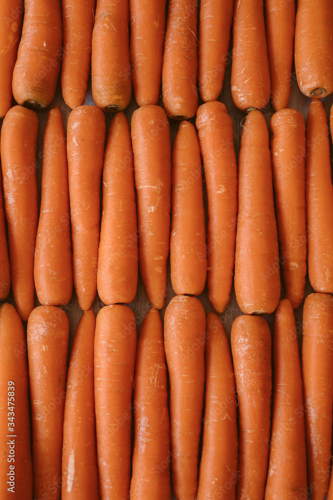 Organic carrots as texture and background. Top view. Organic and healthy carrots at the market. Organic carrots as texture and background. Top view. Organic and healthy carrots at the market.
