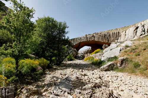 natural stone bridge arch shape, Jisr el Hajar, Faqra, Lebanon  photo