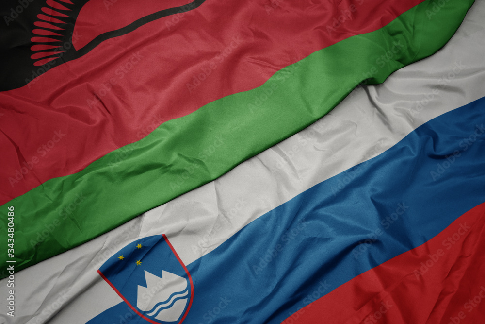 waving colorful flag of slovenia and national flag of malawi. waving colorful flag of slovenia and national flag of malawi.