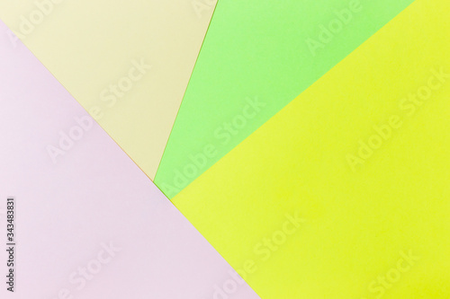 Pastel papers color background is nested backdrop flat lay. green, light green, pink, yellow