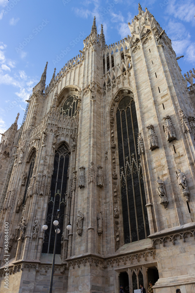 The decorated stone carvings outer wall of the Cathedral of Milan - Duomo di Milano in Milan city, Italy