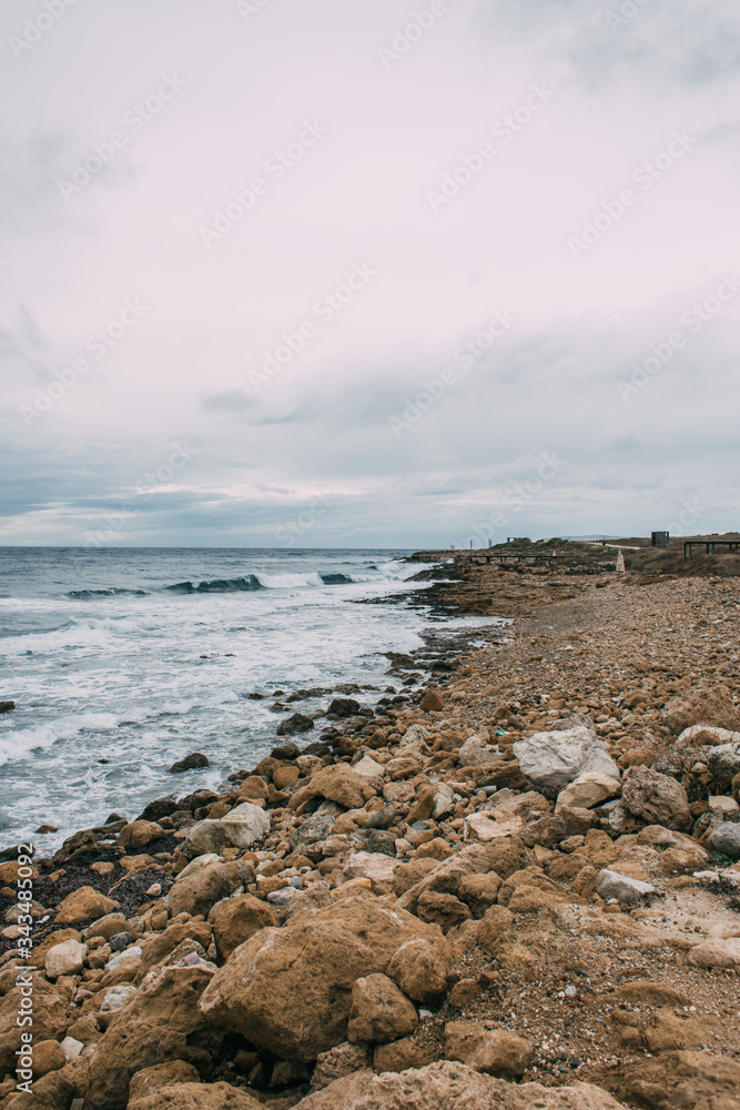 tranquil coastline with stones near mediterranean sea