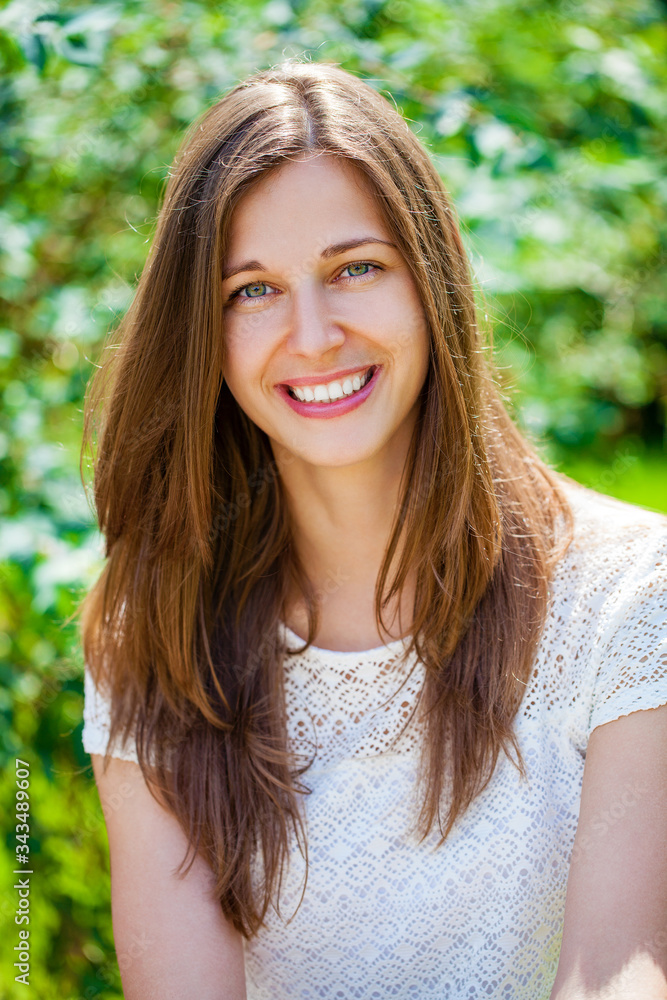 Close up portrait of beautiful young happy brunette woman with fresh and clean skin, summer street outdoors Close up portrait of beautiful young happy brunette woman with fresh and clean skin, summer street outdoors