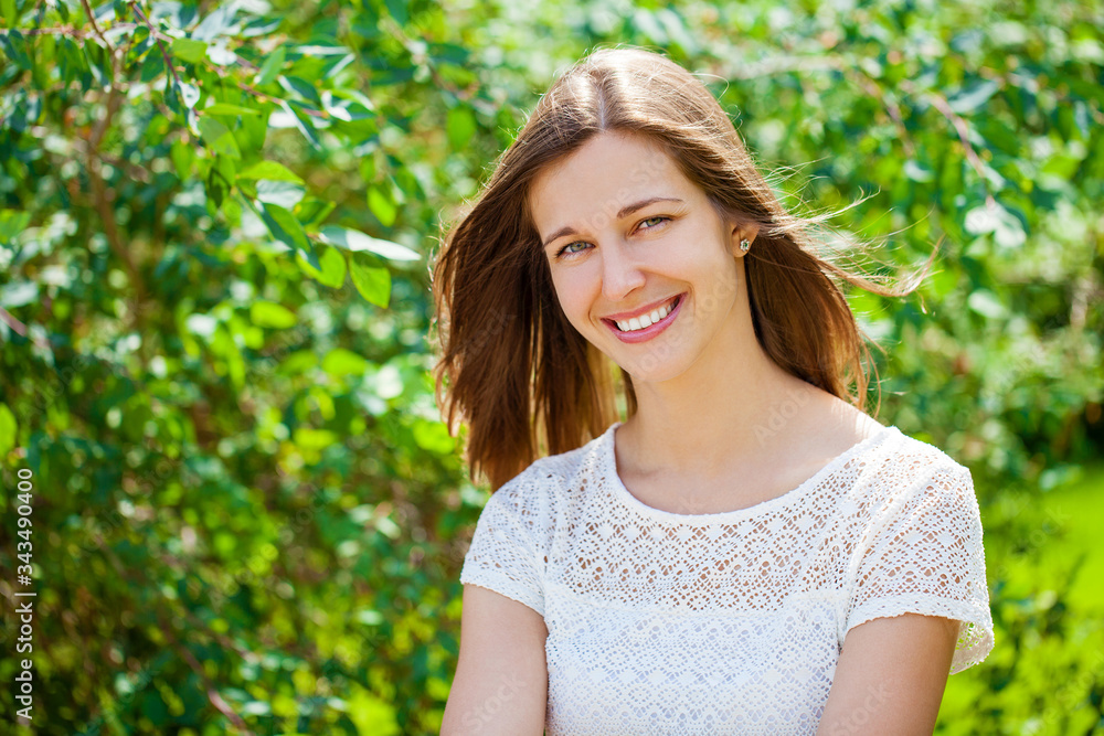 Close up portrait of beautiful young happy brunette woman with fresh and clean skin, summer street outdoors Close up portrait of beautiful young happy brunette woman with fresh and clean skin, summer street outdoors