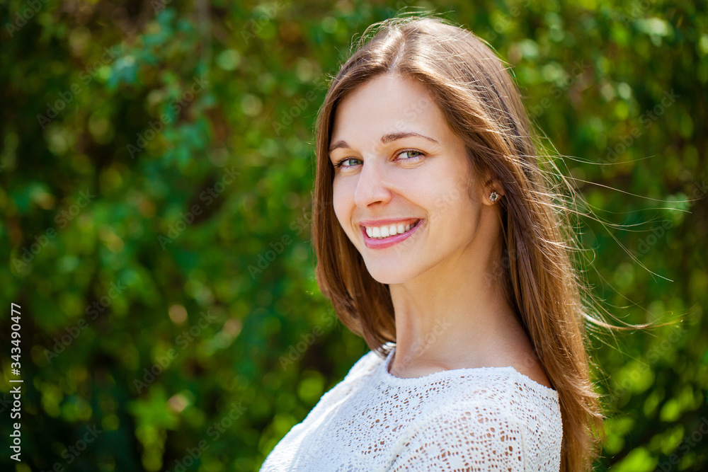 Close up portrait of beautiful young happy brunette woman with fresh and clean skin, summer street outdoors Close up portrait of beautiful young happy brunette woman with fresh and clean skin, summer street outdoors