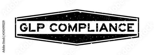 Grunge black GLP (Good Laboratory Practice) compliance word hexagon rubber seal stamp on white background
