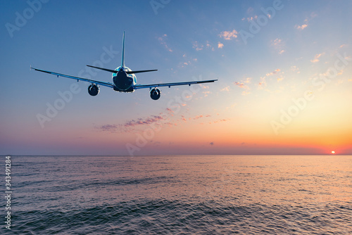 Flight of the plane above the ocean before landing. © serjiob74
