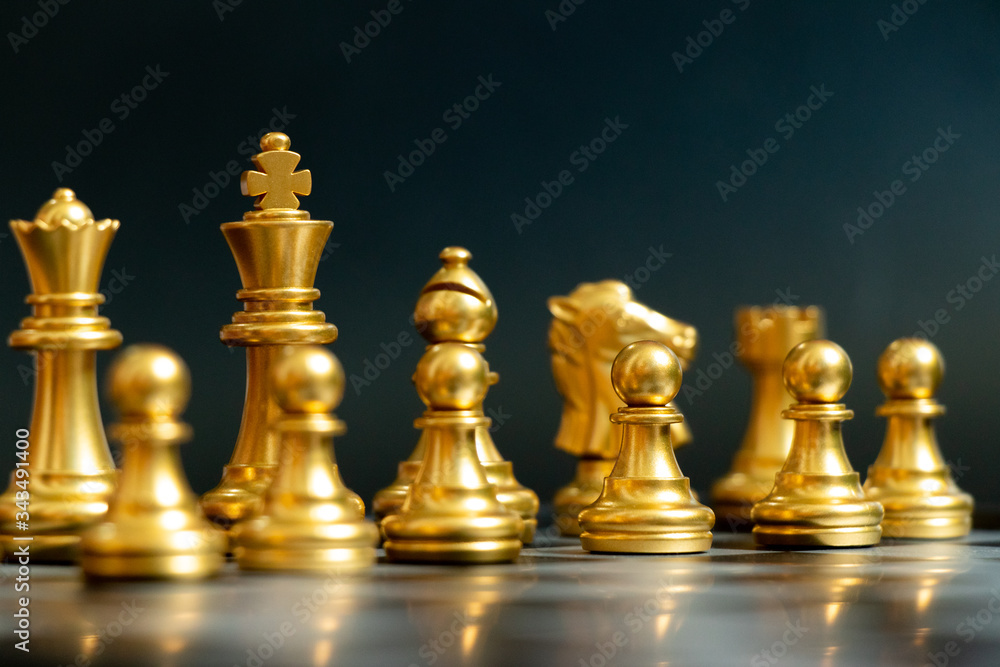 Gold color chess piece wait for movement on black background