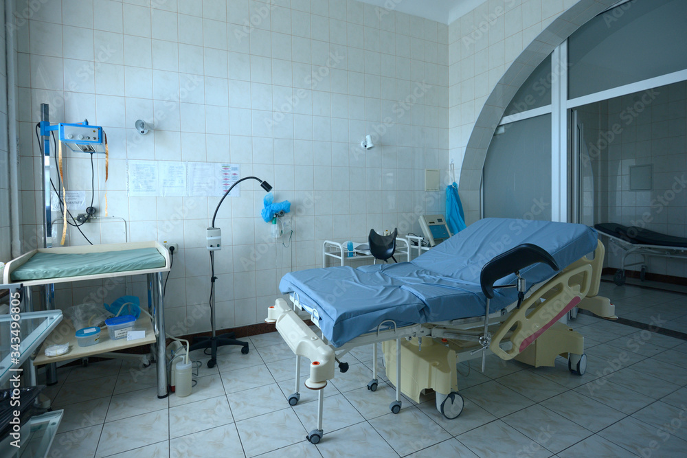 Obstetric bed at the delivery room of the maternity hospital, medical equipment set Obstetric bed at the delivery room of the maternity hospital, medical equipment set