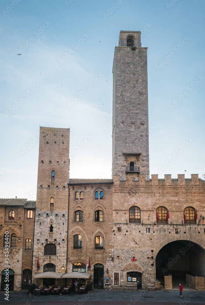 View of the famous towers from the historic center of the village of San Gimignano, a heritage of humanity, on a summer morning