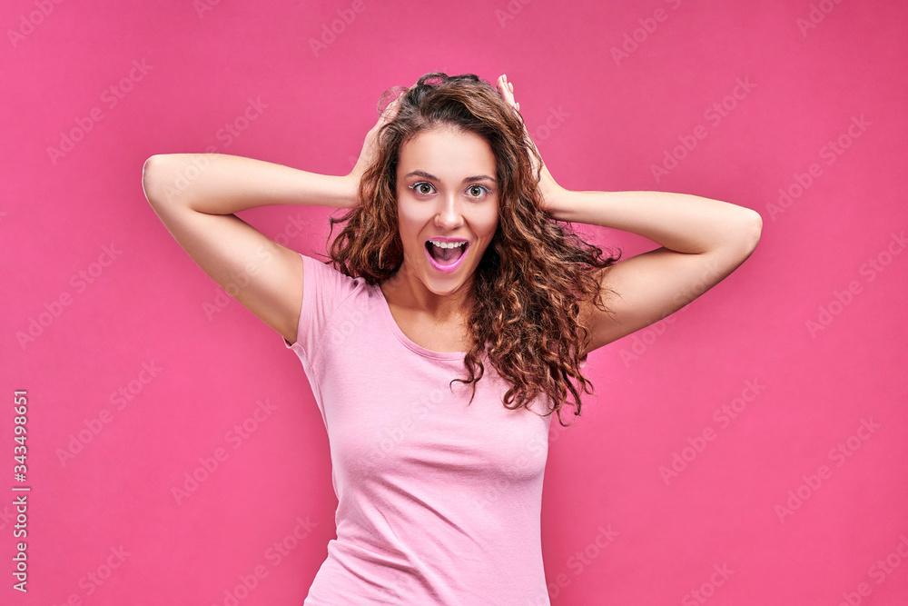 Amazed young woman shouting over pink background. Amazed young woman shouting over pink background.