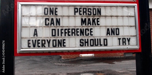 An inspirational sign during the Covid 19 outbreak in America made up of letters behind clear plastic says One Person Can Make A Difference And Everyone Should Try