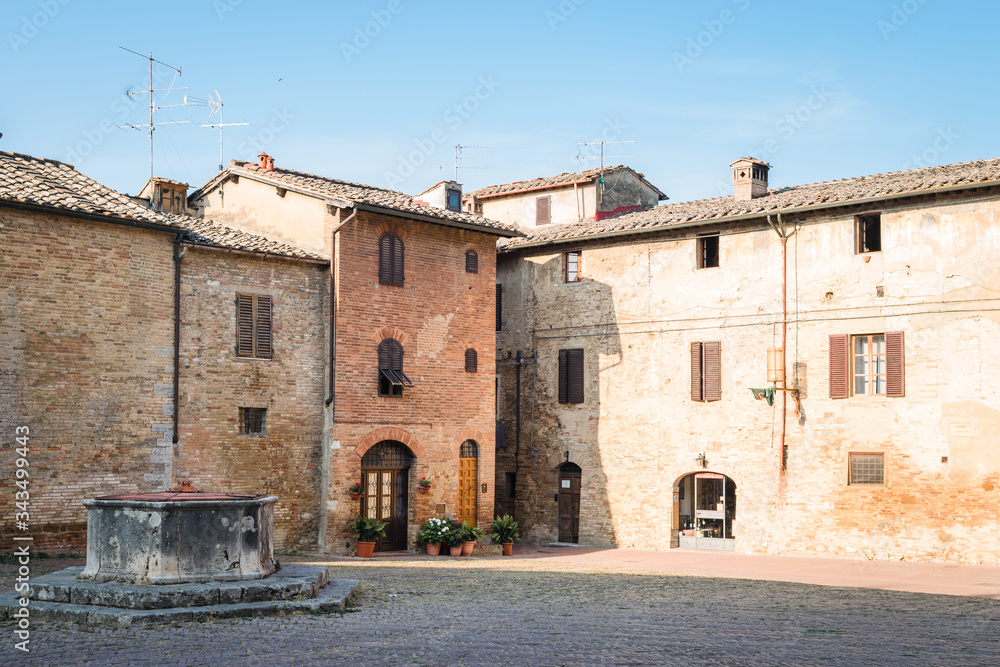 View of the alleys of the historic center of the village of San Gimignano, a heritage of humanity, on a summer morning