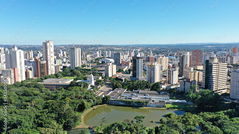 Panoramic view of a park with tropical trees, lakes and residential and comercial buildings around it. Goiania, Goias, Brazil 