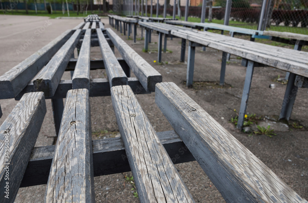 Empty benches in the park. There are no people on the street. Quarantine concept. Empty benches in the park. There are no people on the street. Quarantine concept.